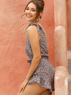 off-shoulder short-sleeved diagonal floral jumpsuit